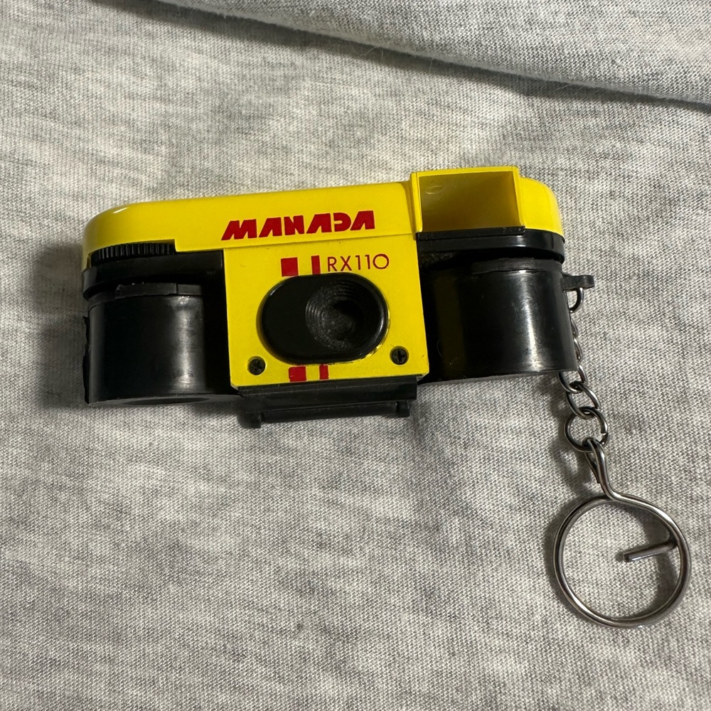 Manada RX110 Yellow and Black Camera Keychain
